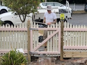 Front picket fence in white built by Gleeson Build