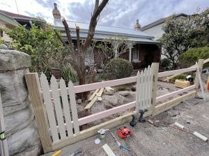 Front picket fence in white built by Gleeson Build