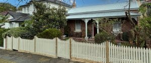 Front picket fence in white built by Gleeson Build