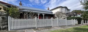 Front picket fence in white built by Gleeson Build