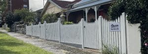 Front picket fence in white built by Gleeson Build