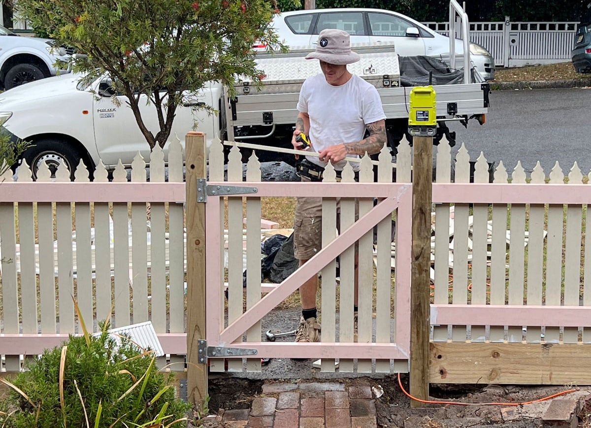 Bob Barker Photography for Bobs Odd Jobs Tyler Gleeson working on building a fence